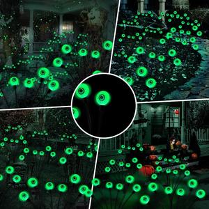 Get your yard ready for Halloween with our Spooky Solar Eyeball Lights! This 2-pack features 12 LED green lights that sway like fireflies. Perfect for outdoor decor in your garden, lawn, or party. Waterproof and eerie fun awaits! BeHiller